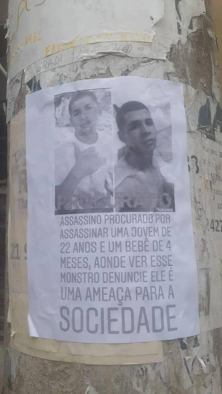 Cartaz sobre suspeito por mortes de mulher e bebê